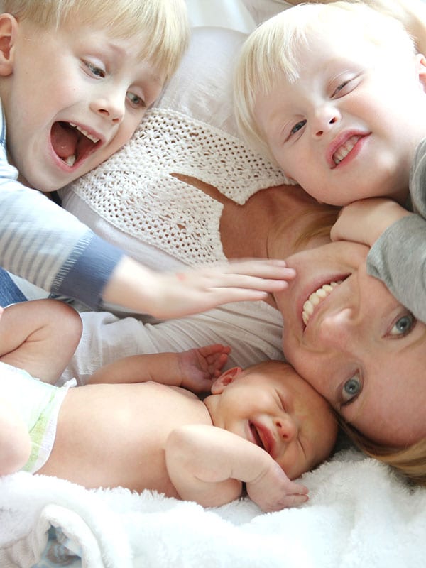 incontinence after pregnancy, woman playing with her kids